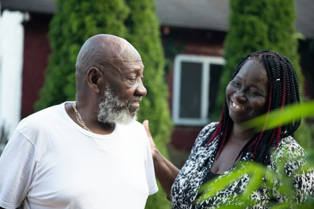 A man and woman smiling together.