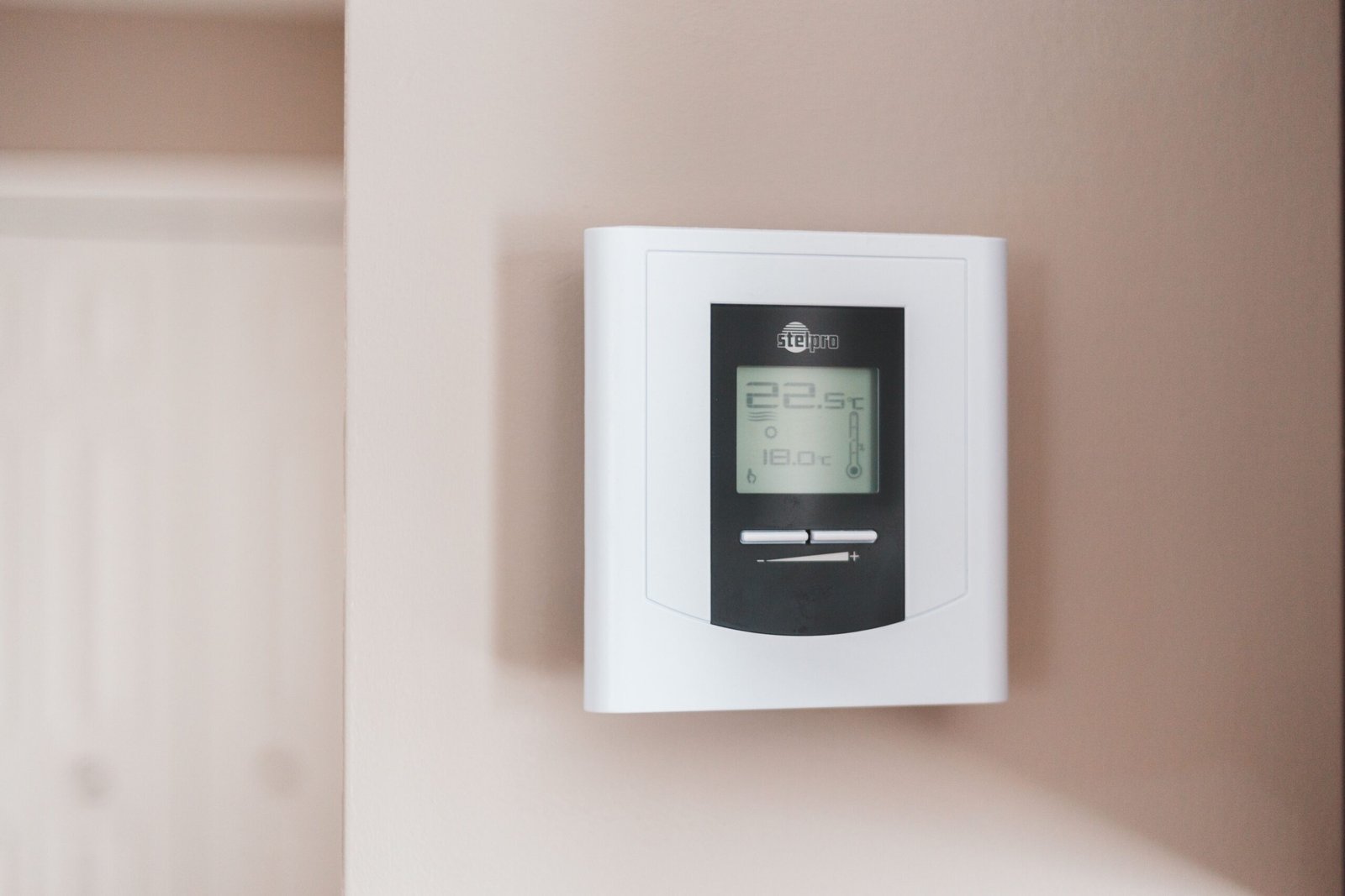 Wall thermostat used to control indoor temperature.