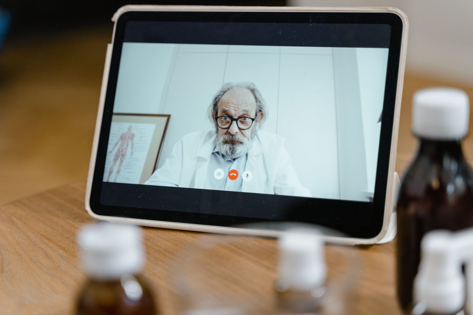 Doctor visible on a tablet during a care communication call.