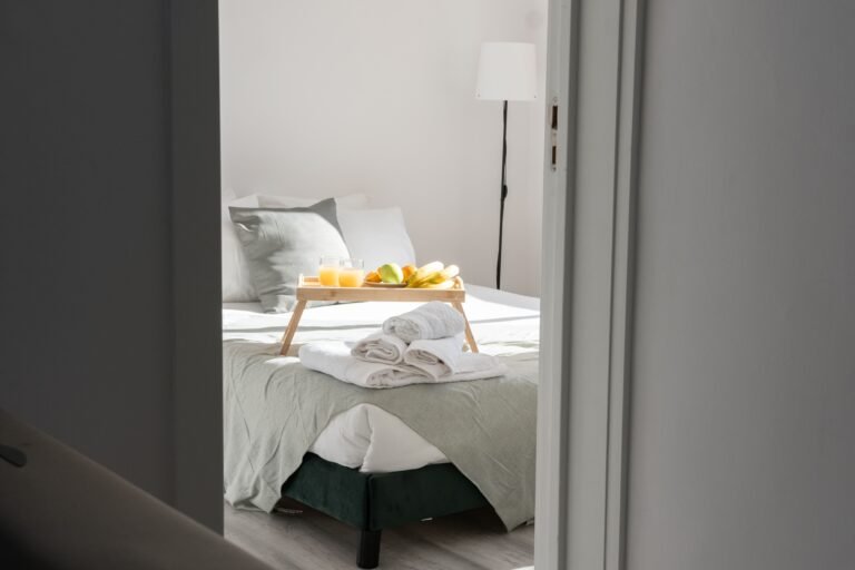 Bedroom interior with bedside space for home medical equipment.