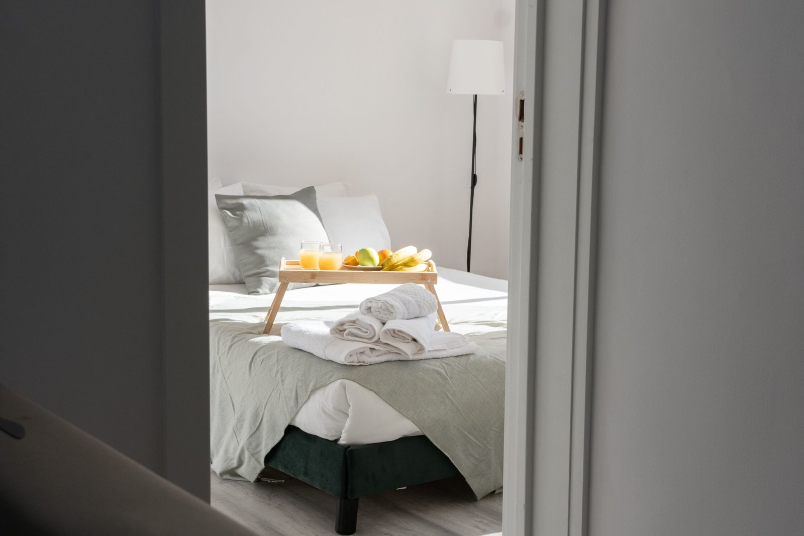 Bedroom interior with bedside space for home medical equipment.