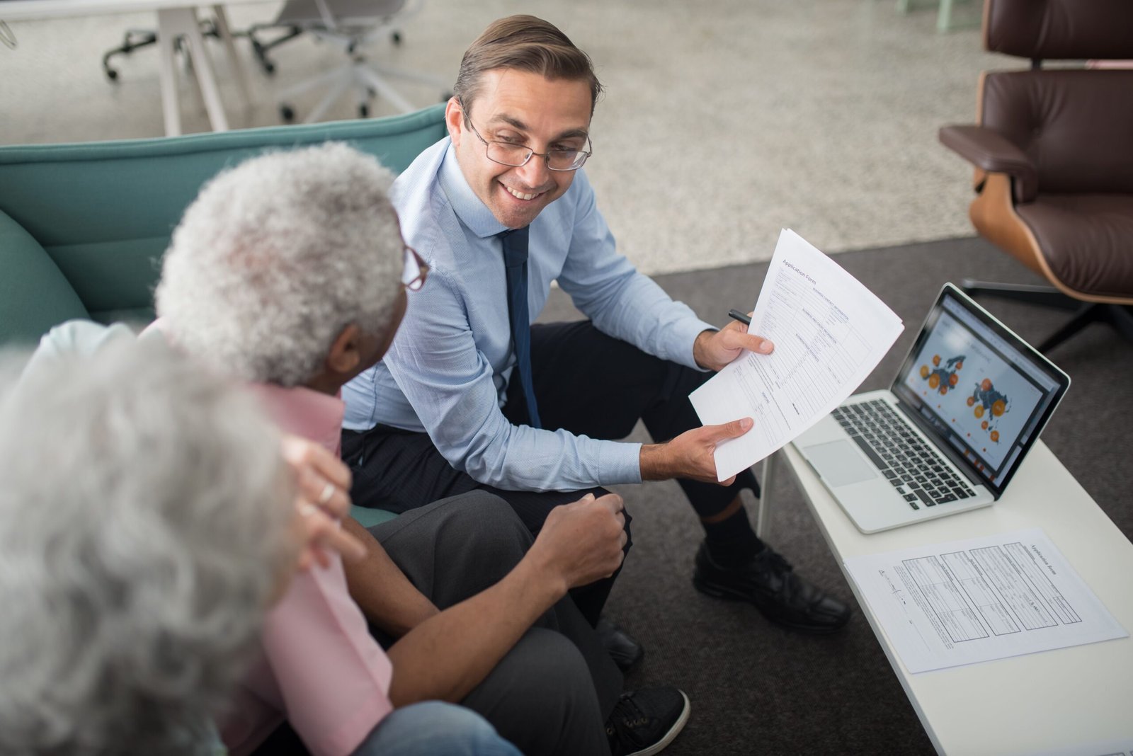 Older adults reviewing care and pricing documents with an advisor