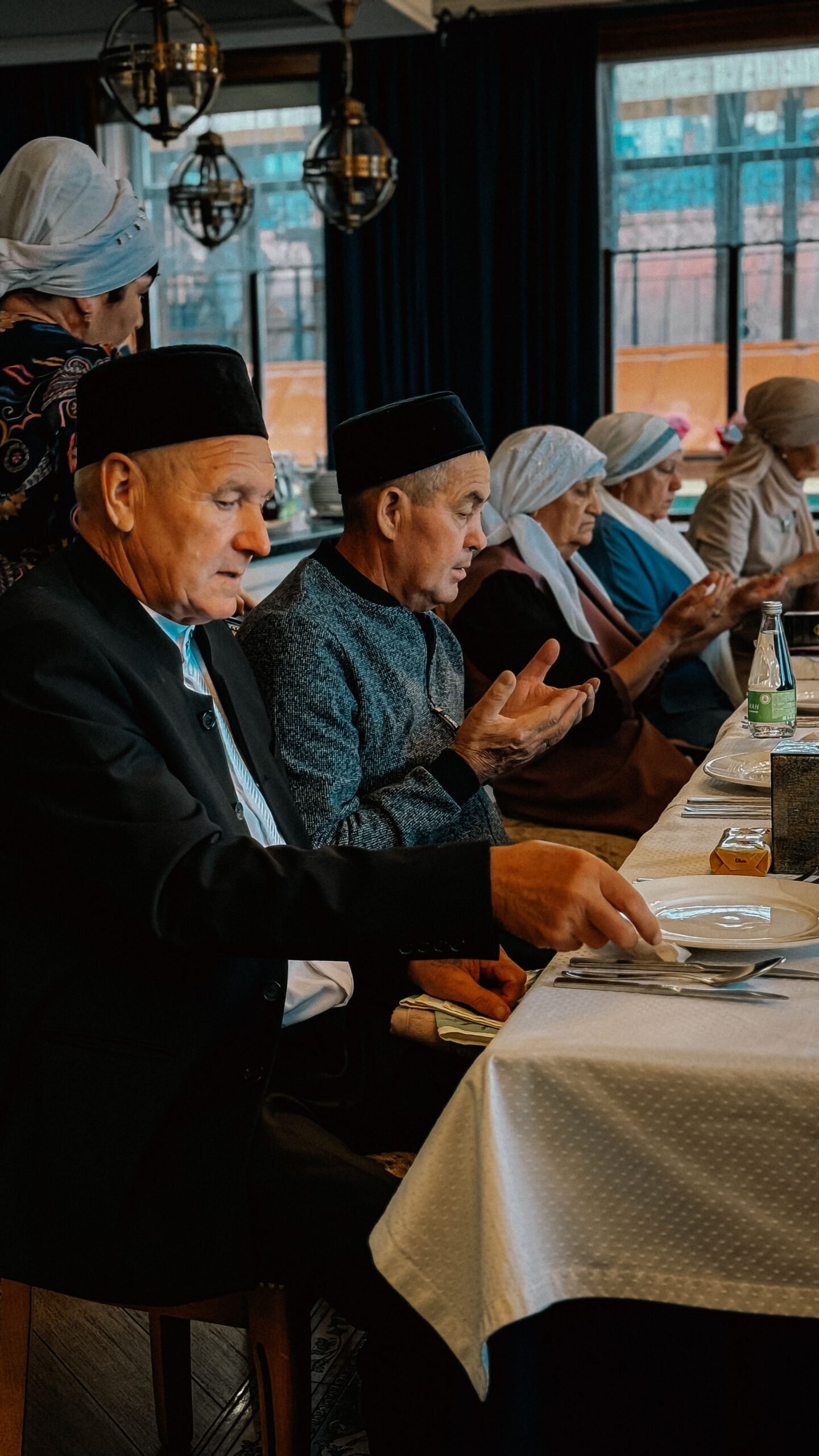 Older adults gathered together indoors during a family visit.