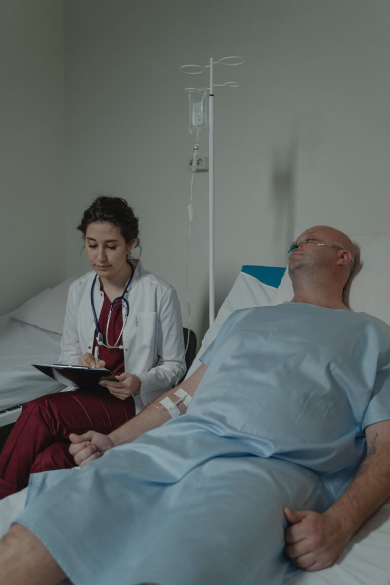 Doctor reviewing a medical chart while speaking with a patient