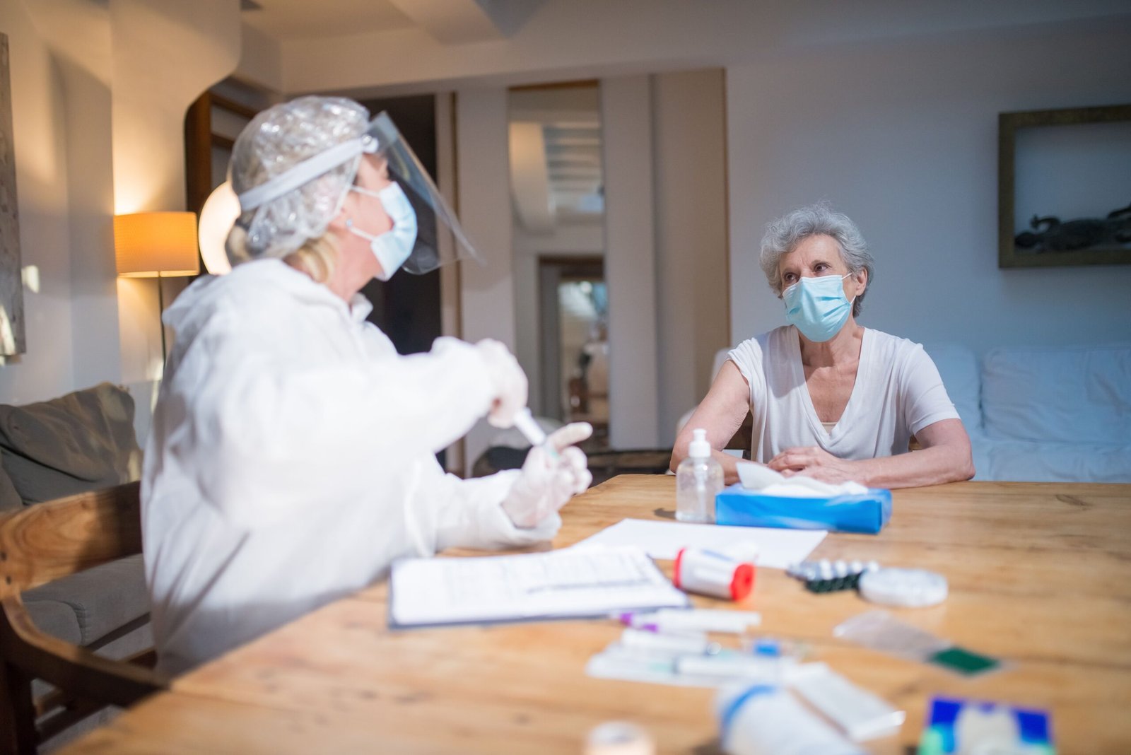 Healthcare professional discussing care with an older patient