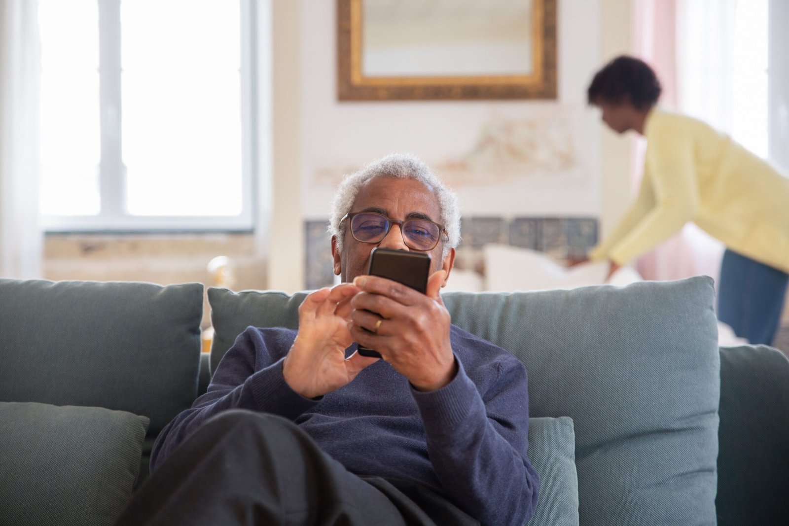 Older adult and caregiver in an illustrative long-term-care or home-support setting.
