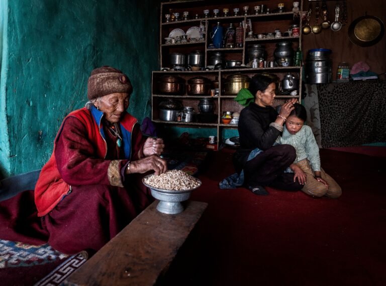 Family gathered with an older adult in a home setting.