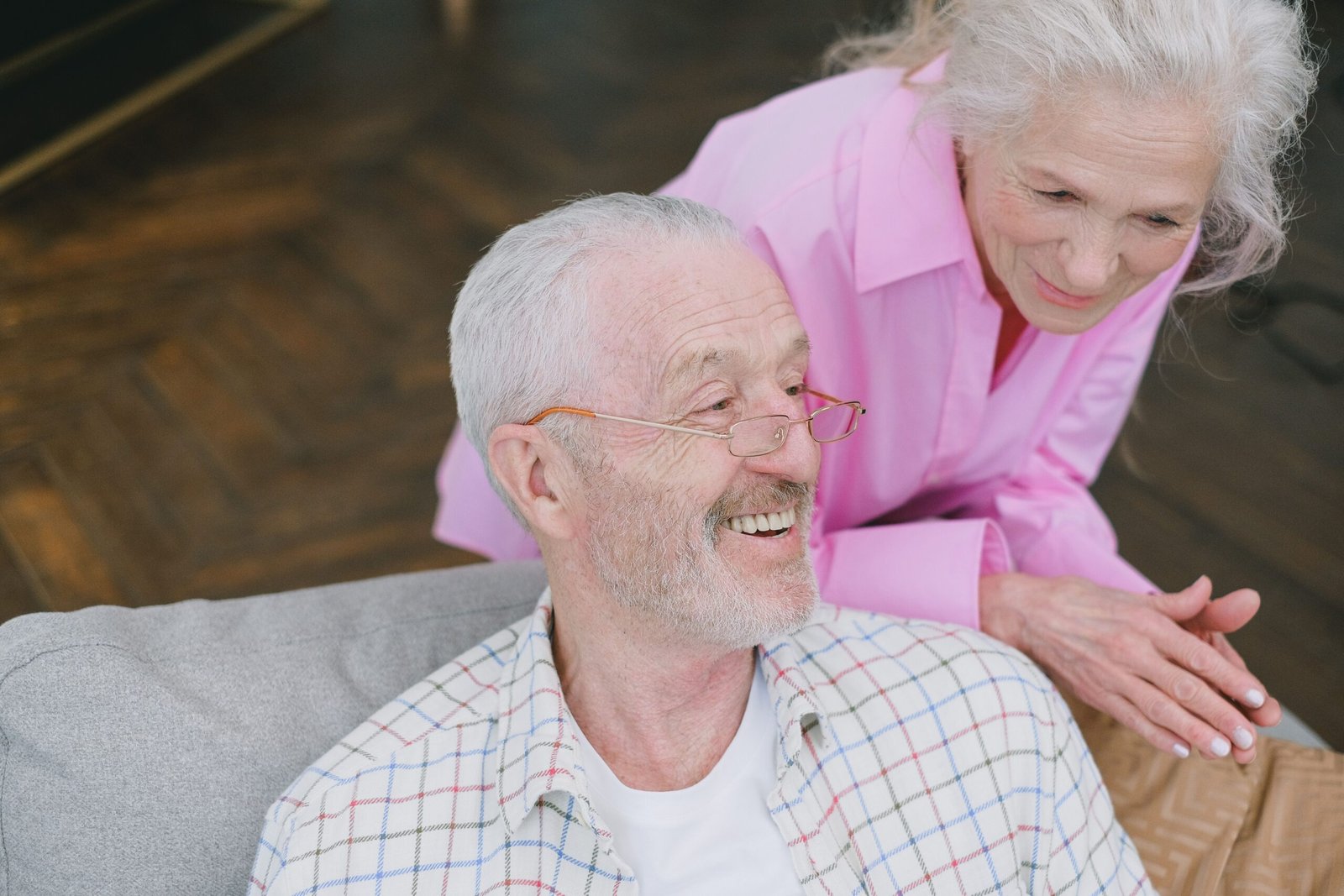 Older couple having a thoughtful conversation at home.