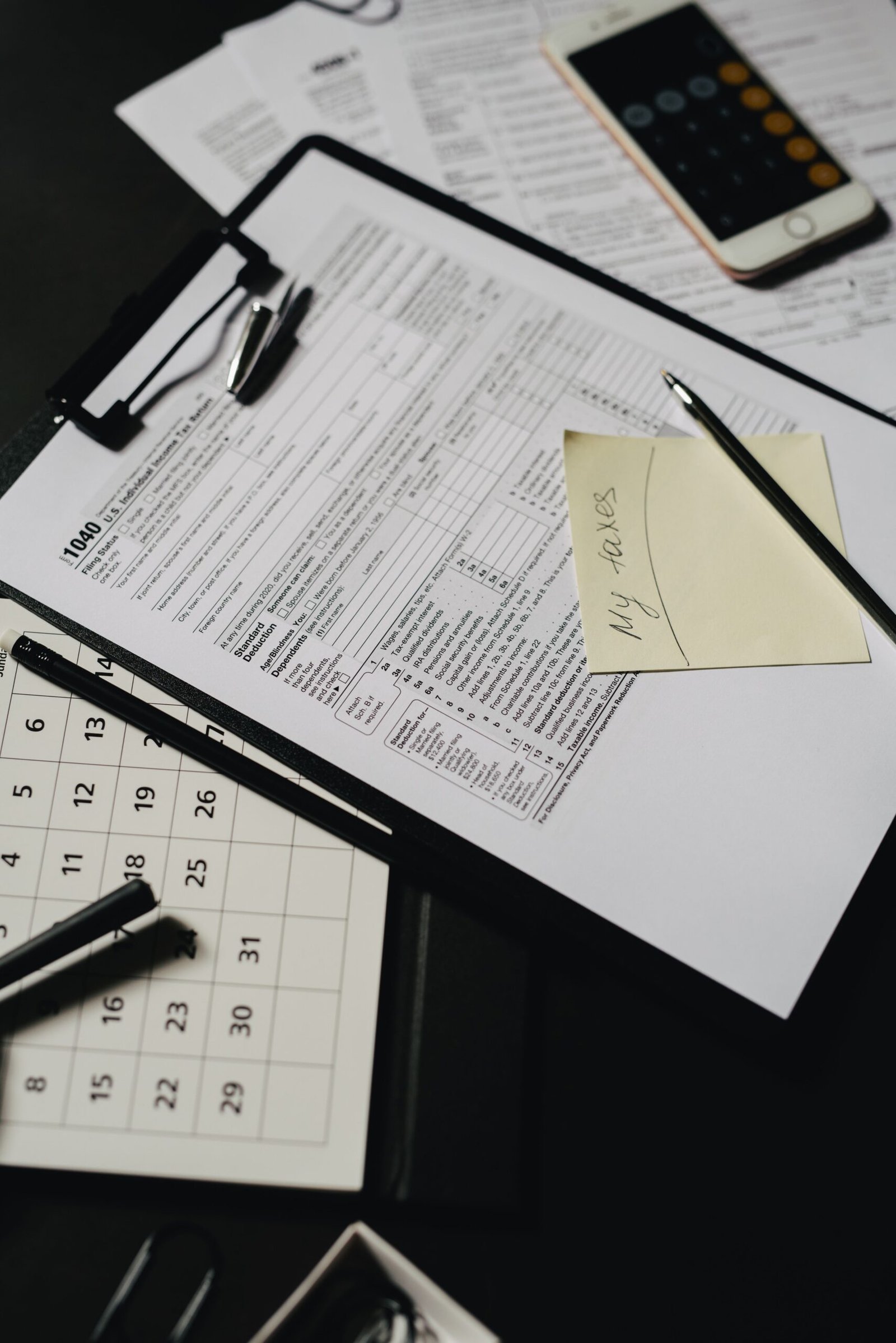 Financial paperwork arranged for insurance and benefits planning.