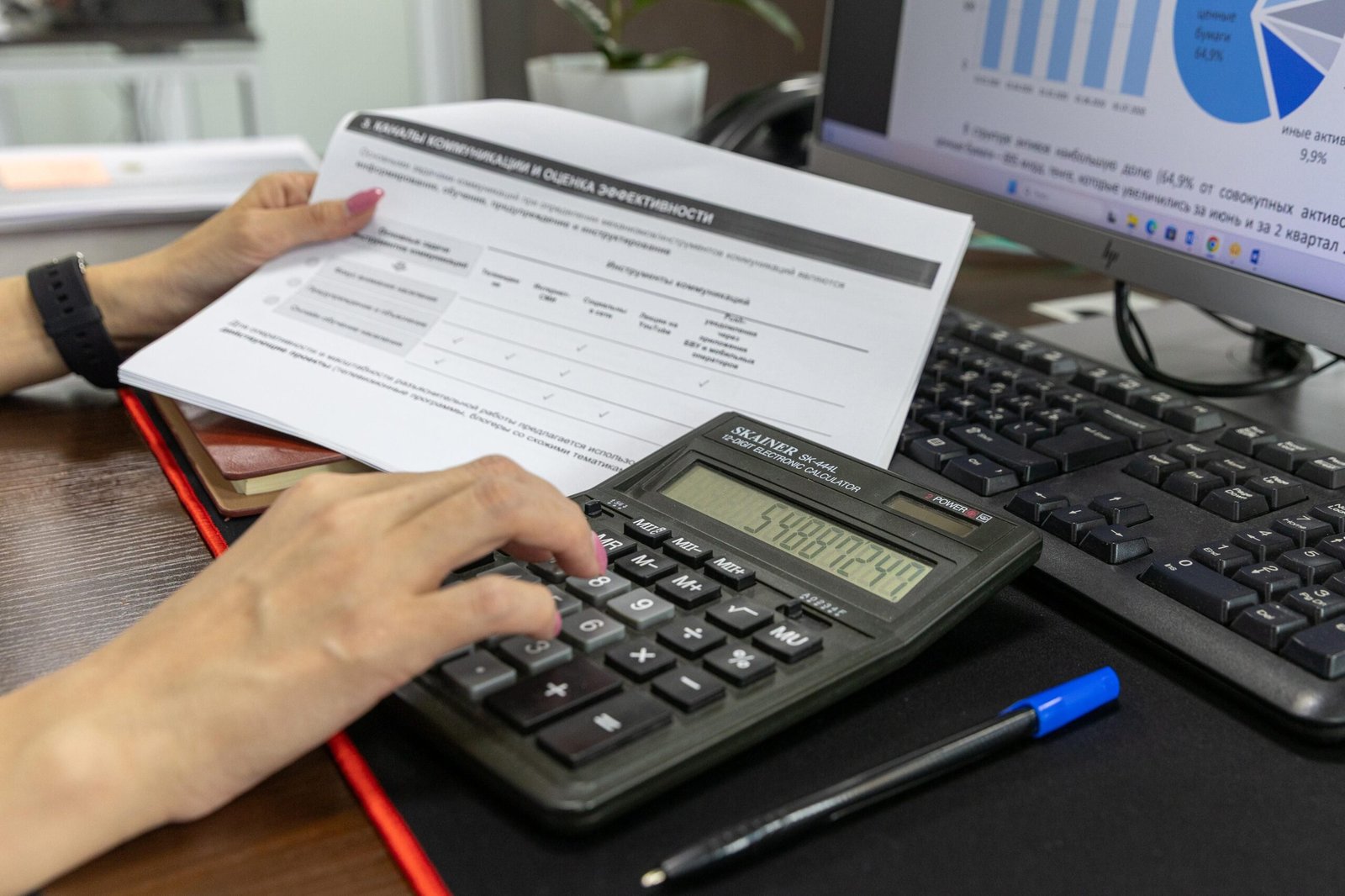 Calculator and financial paperwork arranged for a Medicaid eligibility review.