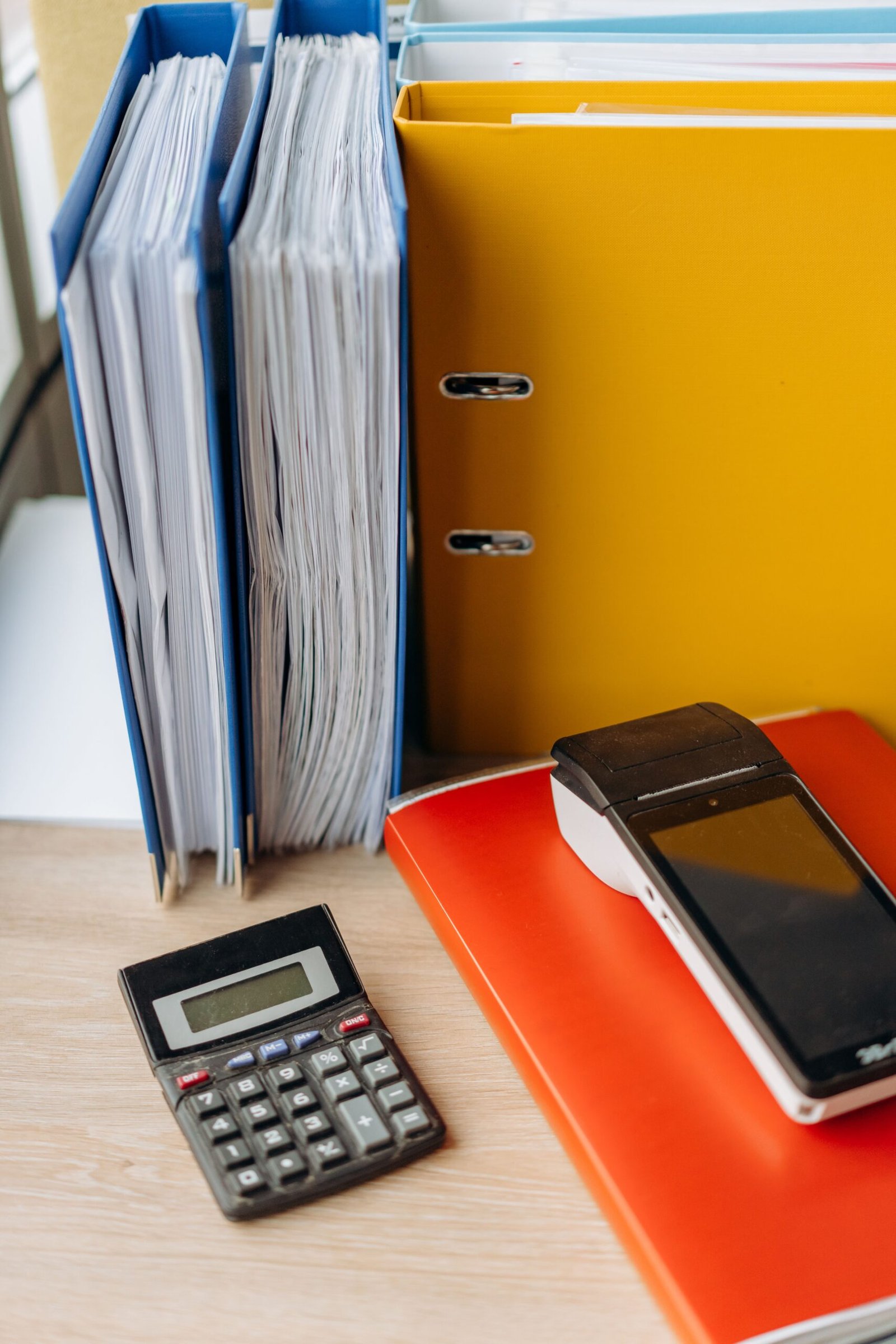 Calculator and organized files prepared for a benefits appeal.