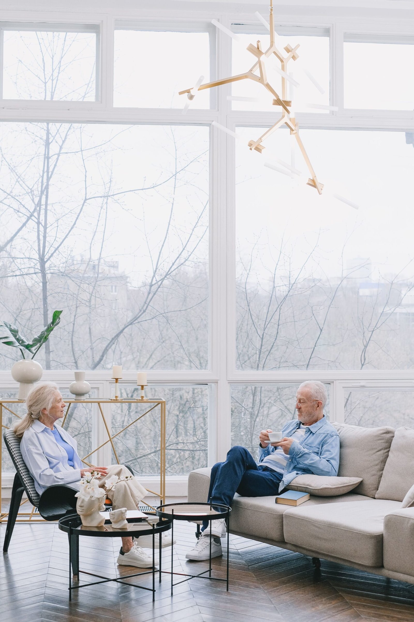 Older couple relaxing together over coffee at home.
