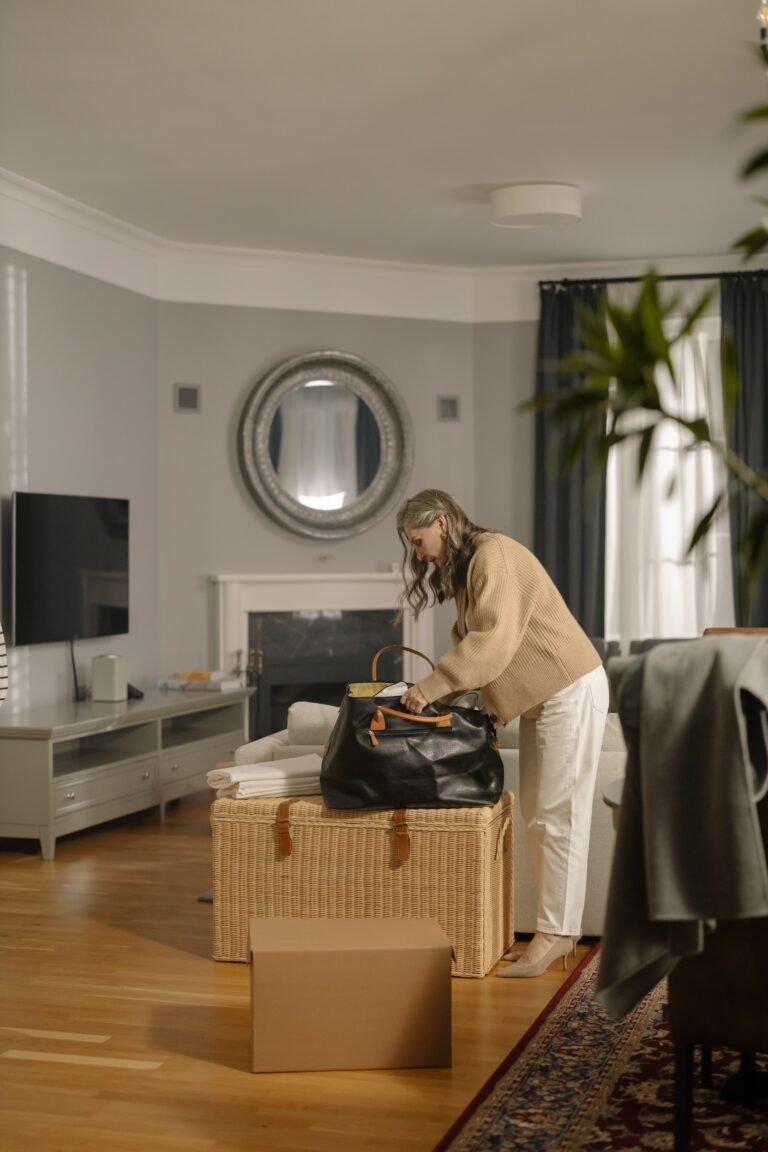 Older adult packing belongings for a move.