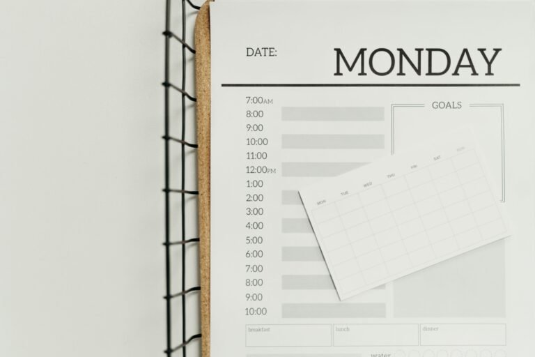 Open weekly planner on a table for reviewing the first month of care