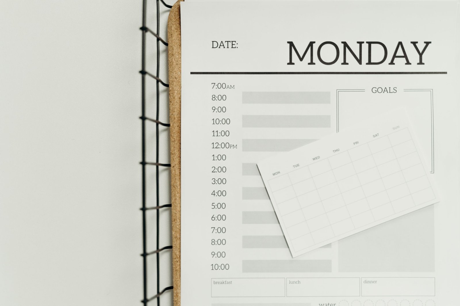 Open weekly planner on a table for reviewing the first month of care