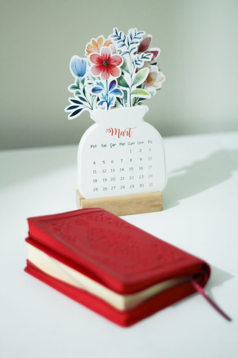Calendar and notebook arranged on a table for appointment planning