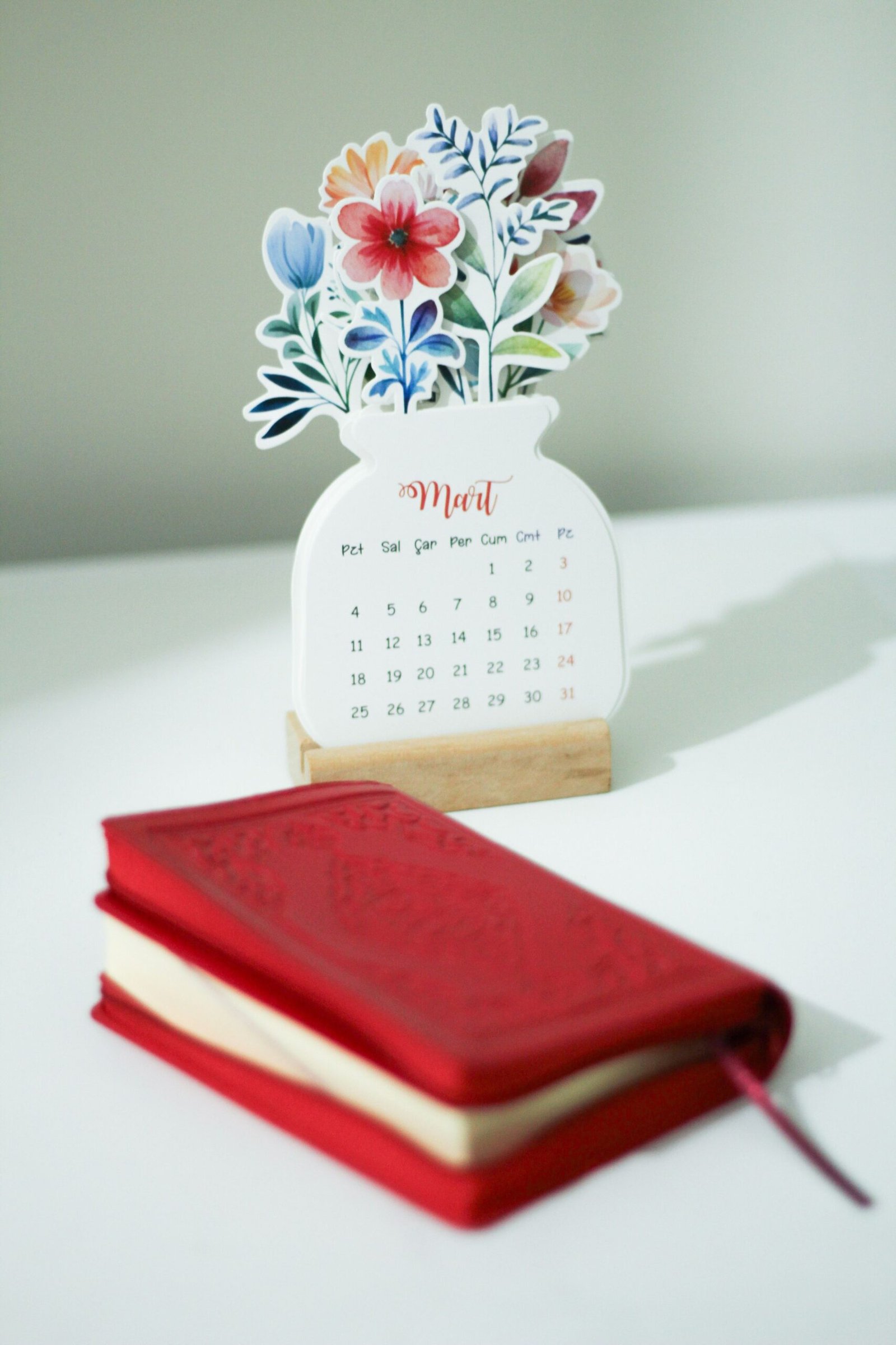 Calendar and notebook arranged on a table for appointment planning