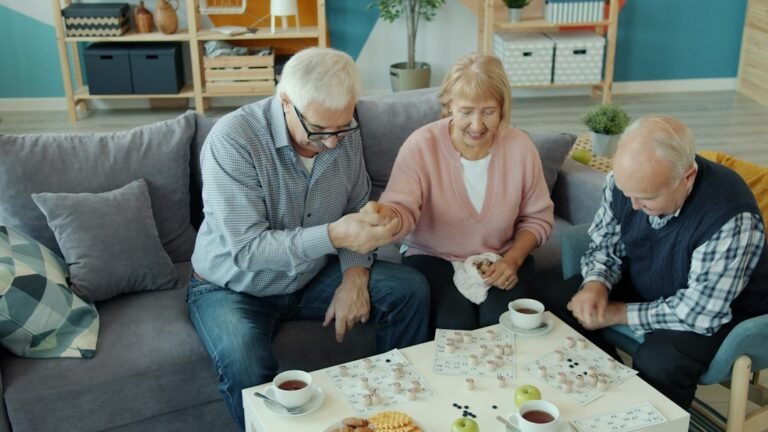 Older adults spending time together around a table in a shared living setting