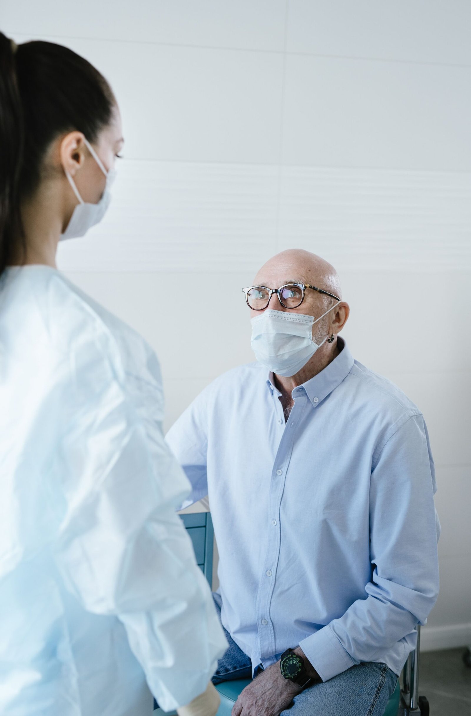 Older adult speaking with a healthcare professional during a medical consultation