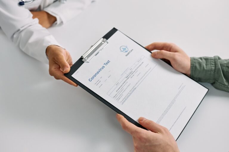 Healthcare professional reviewing a medical test result with a patient.