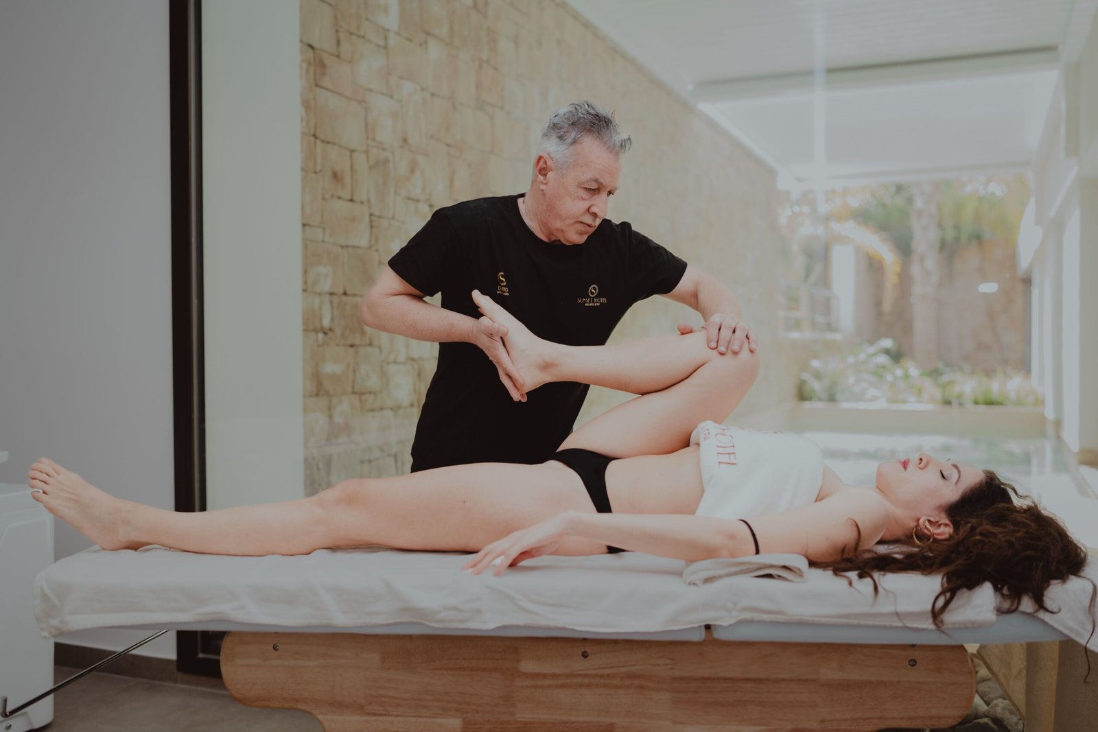 Physical therapist assisting a patient during a rehabilitation session