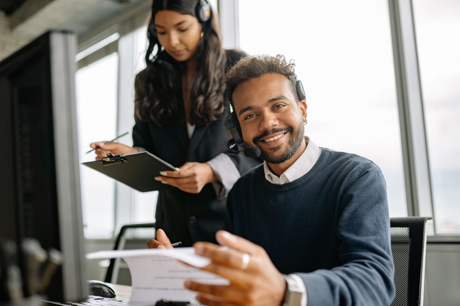 Customer-service professional wearing a headset during a coverage call.